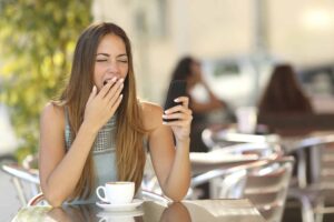 Woman yawning through lack of sleep